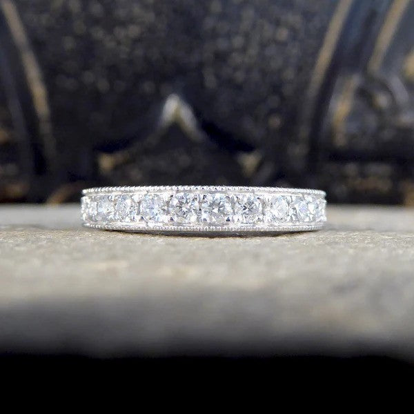 Platinum half eternity ring with diamonds.