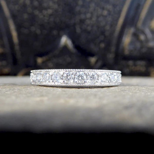 Platinum half eternity ring with diamonds.