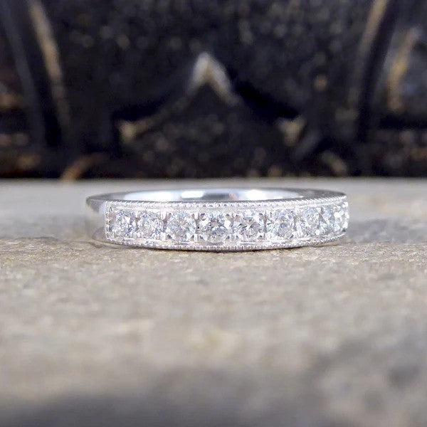Platinum half eternity ring with diamonds.