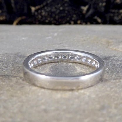 Platinum half eternity ring with diamonds.