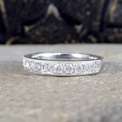 Platinum half eternity ring with diamonds.
