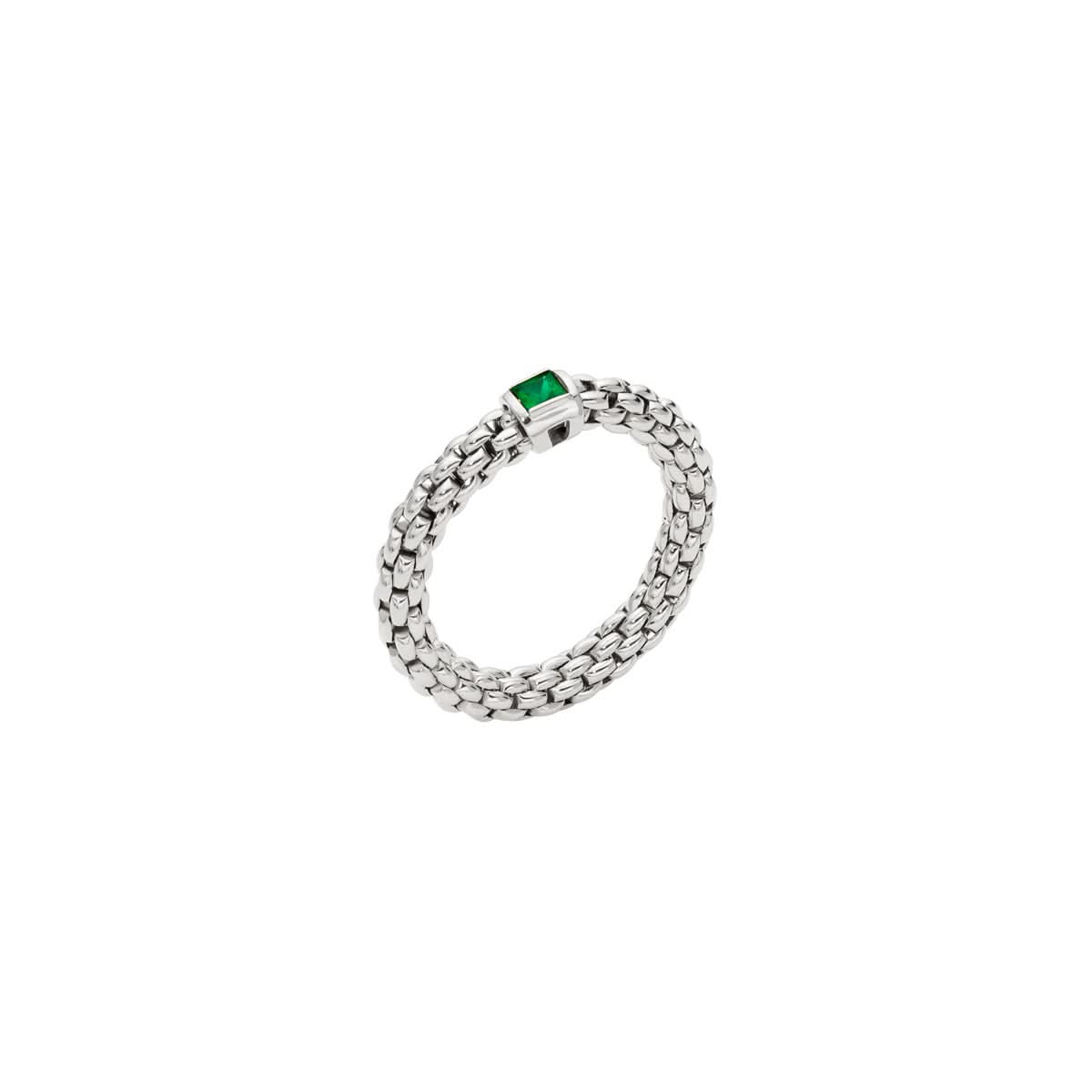 A white gold flexible ring set with a square cut emerald