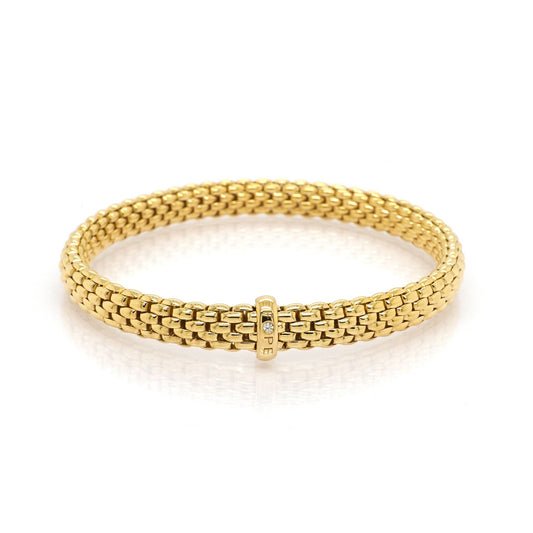 A yellow gold brick link bracelet with a diamond set clasp