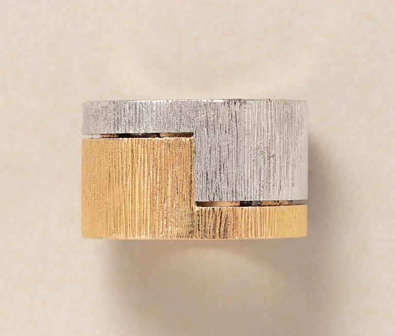 A vintage 18ct yellow and white gold diamond band ring