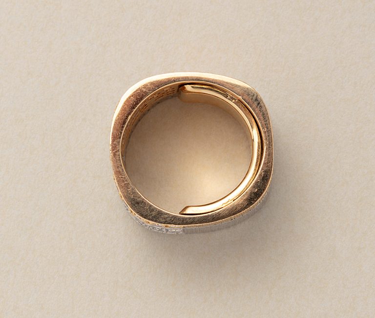 A vintage 18ct yellow and white gold diamond band ring