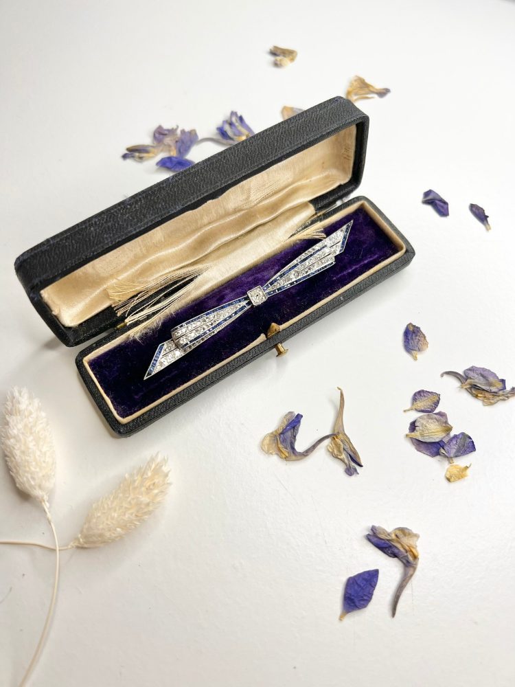 Antique Edwardian Platinum Bow Brooch with Diamond and Sapphires, Circa 1910