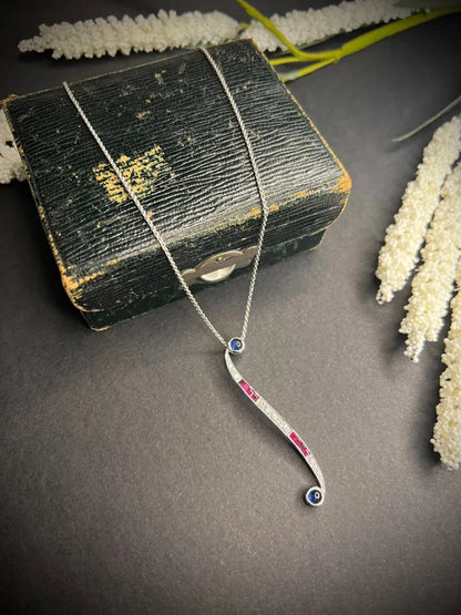 Contemporary 18 Carat White Gold, Sapphire, Ruby, And Diamond Pendant Necklace