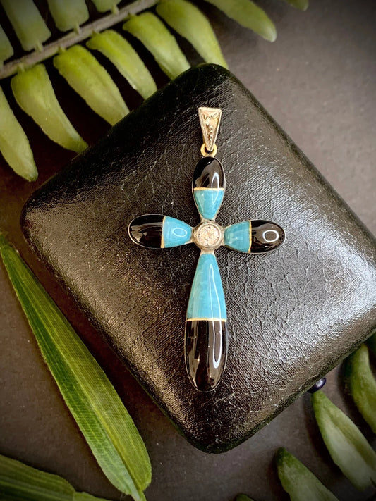 A yellow gold cross pendant with turquoise, black enamel and diamonds