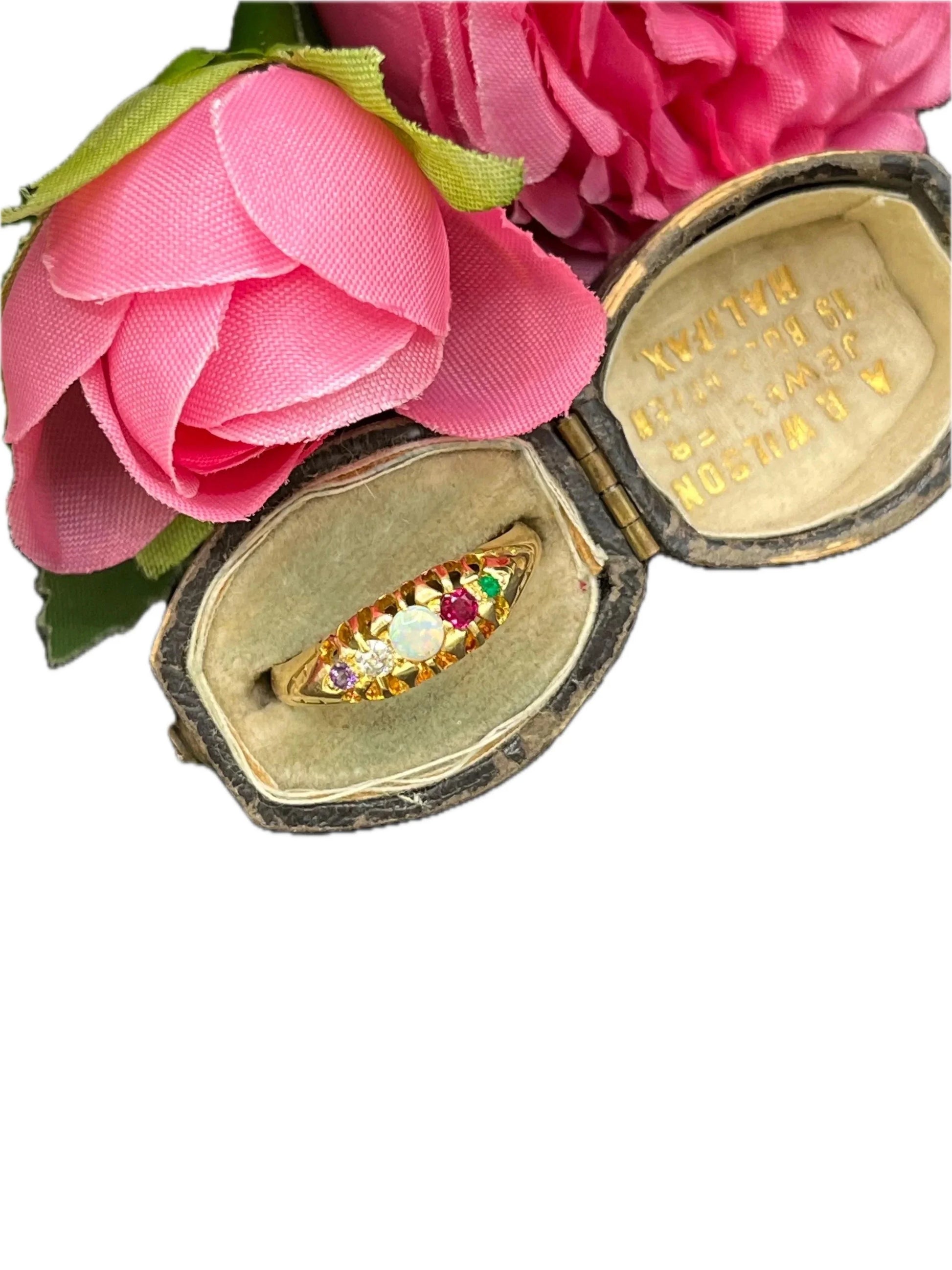 A yellow gold multi-gemstone acrostic ring, in an antique ring box