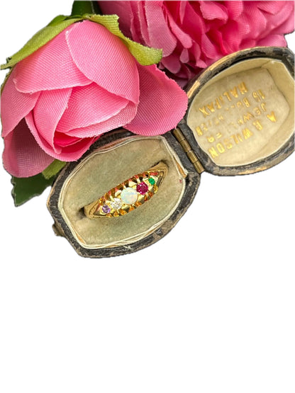 A yellow gold multi-gemstone acrostic ring, in an antique ring box