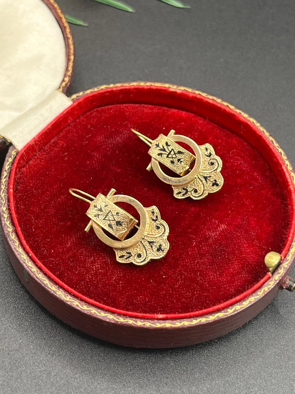 A pair of yellow gold and black enamel drop earrings, in an antique box