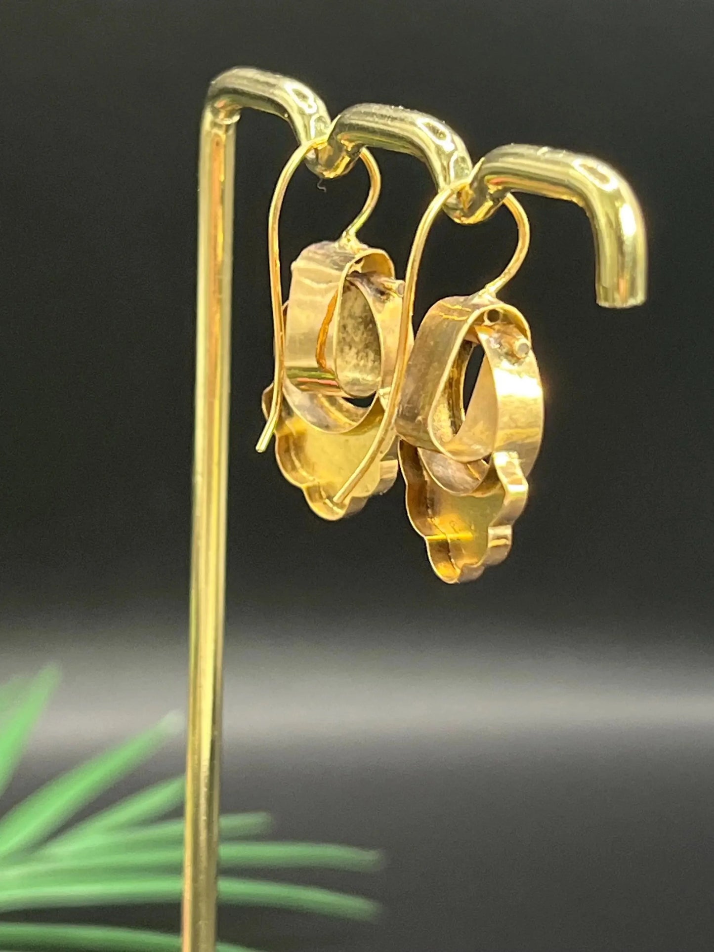 A pair of yellow gold and black enamel drop earrings