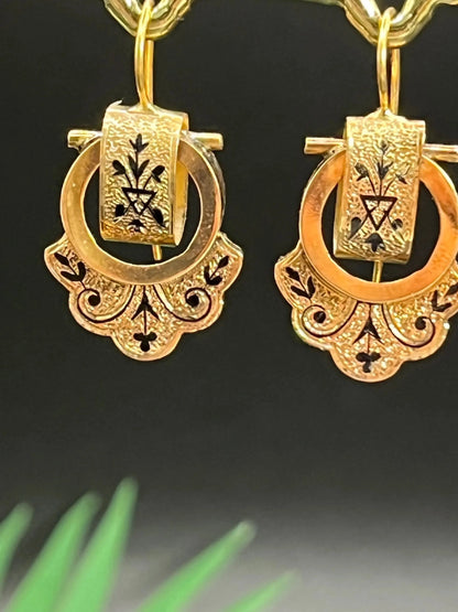 A pair of yellow gold and black enamel drop earrings