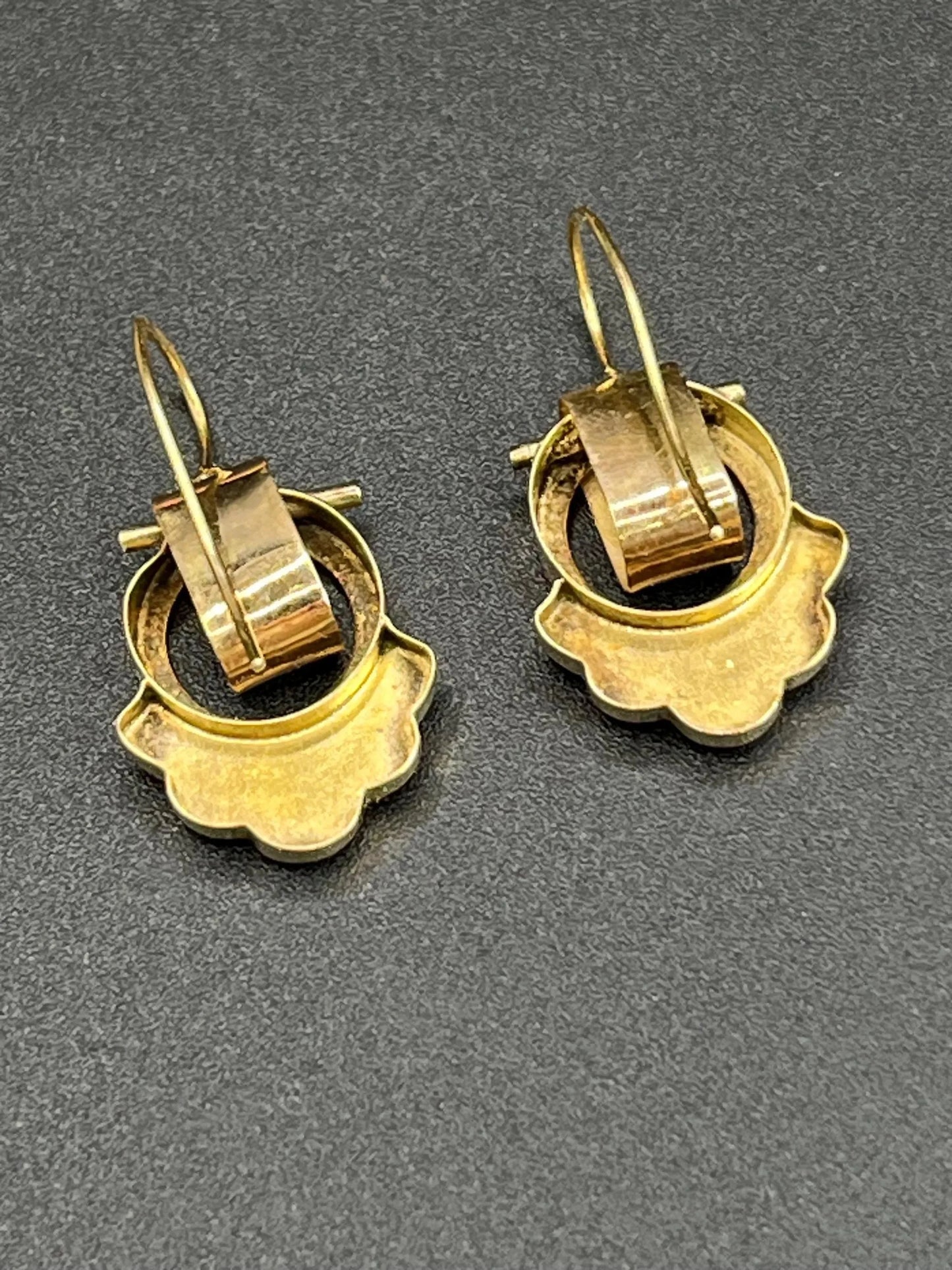 A pair of yellow gold and black enamel drop earrings
