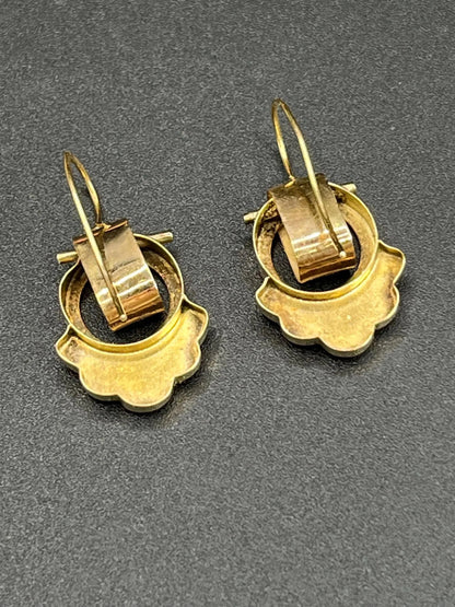 A pair of yellow gold and black enamel drop earrings