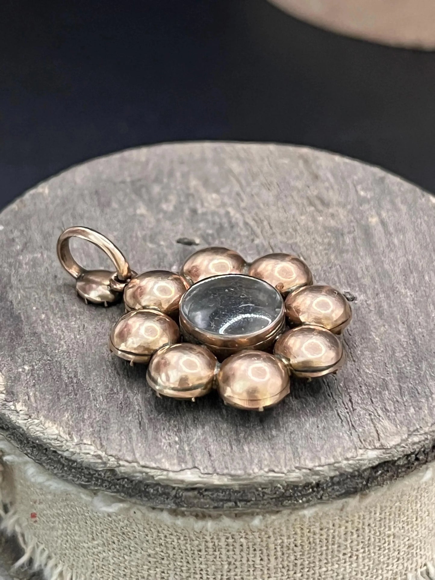 An antique garnet locket pendant in gold