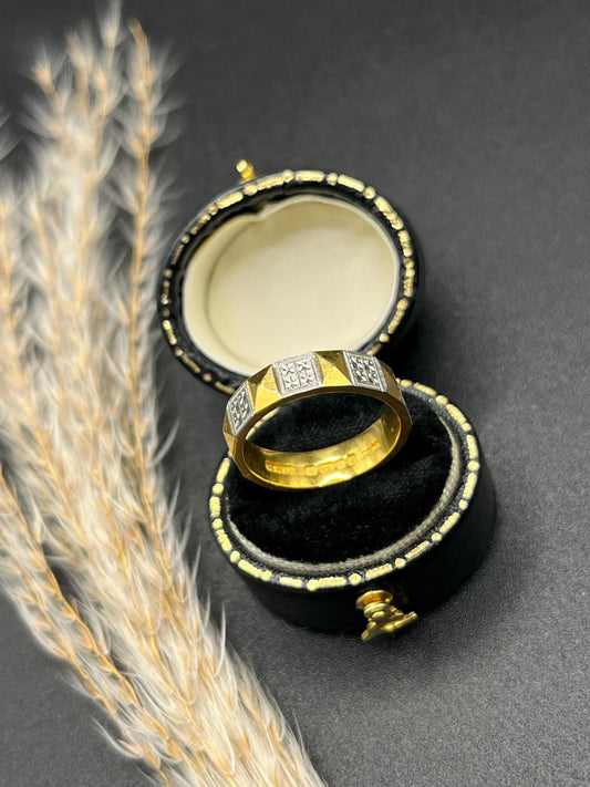 A yellow gold and platinum geometric band ring, in a ring box
