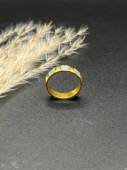 A yellow gold and platinum geometric band ring