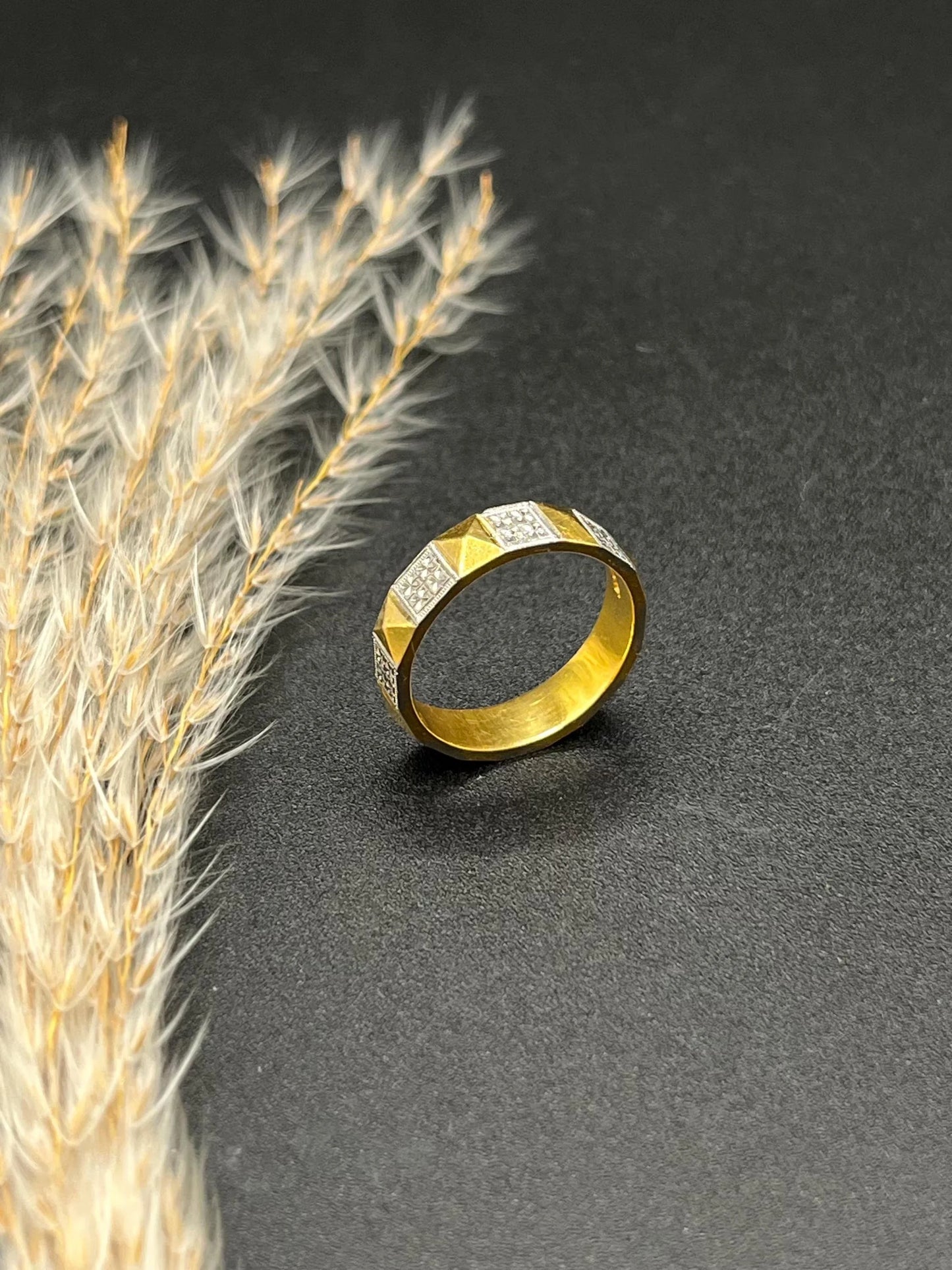 A yellow gold and platinum geometric band ring