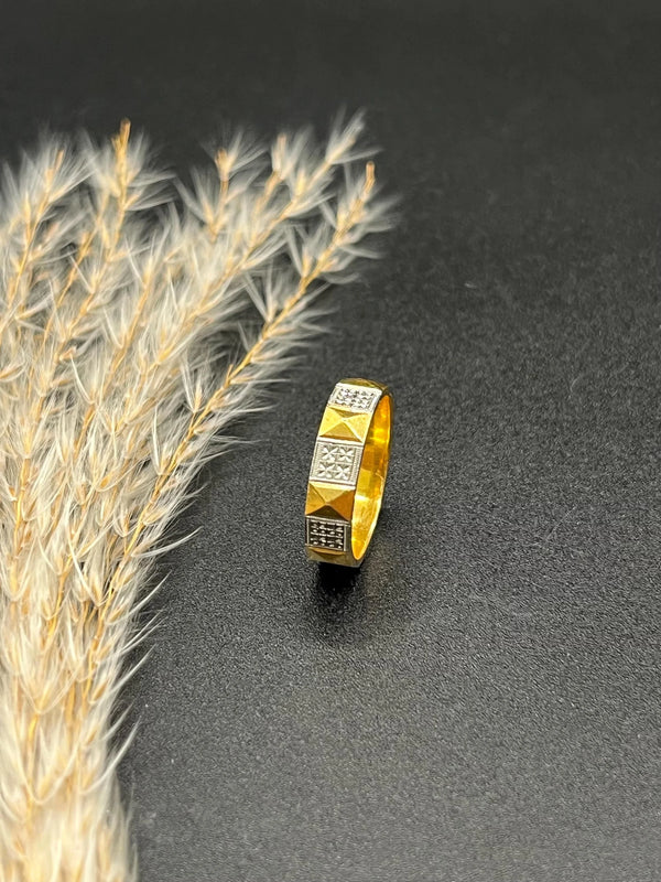 A yellow gold and platinum geometric band ring