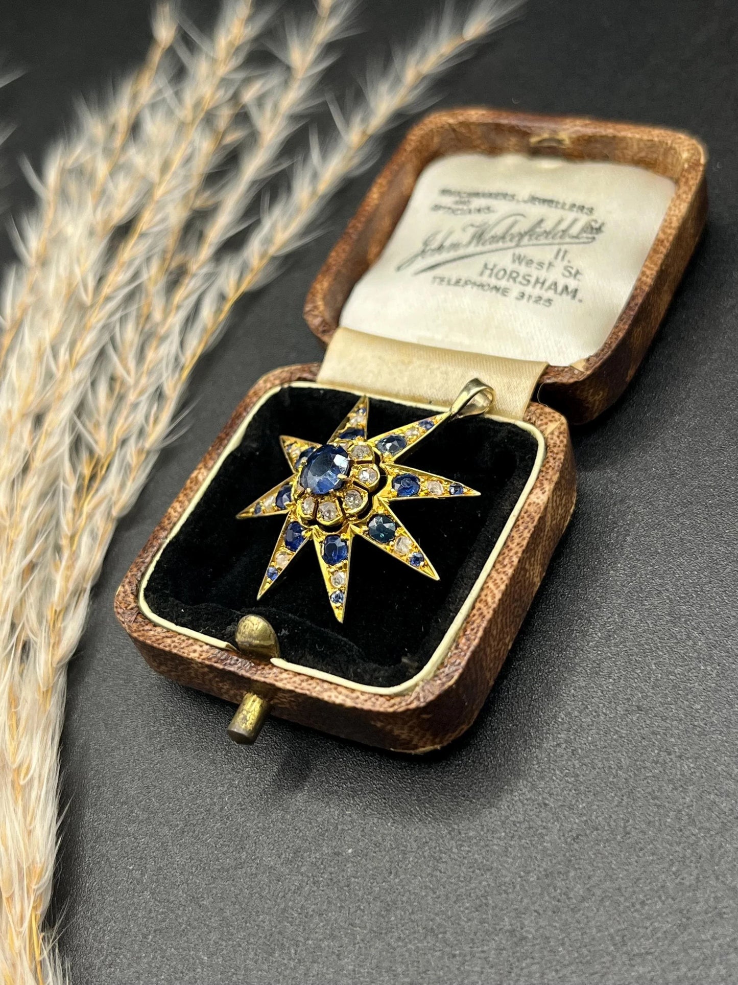 Edwardian 15 Carat Gold Sapphire and Diamond Starburst Pendant, Circa 1900
