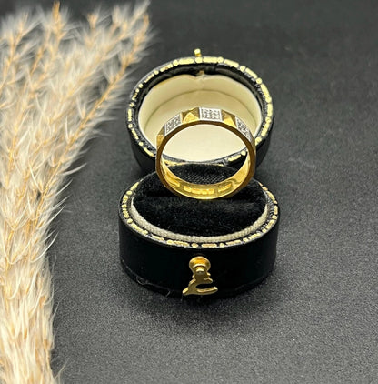 A yellow gold and platinum geometric band ring, in a ring box