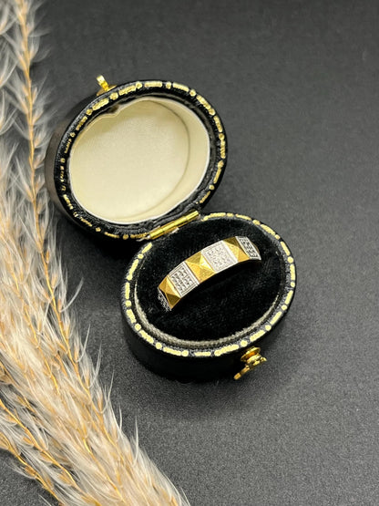 A yellow gold and platinum geometric band ring, in a ring box