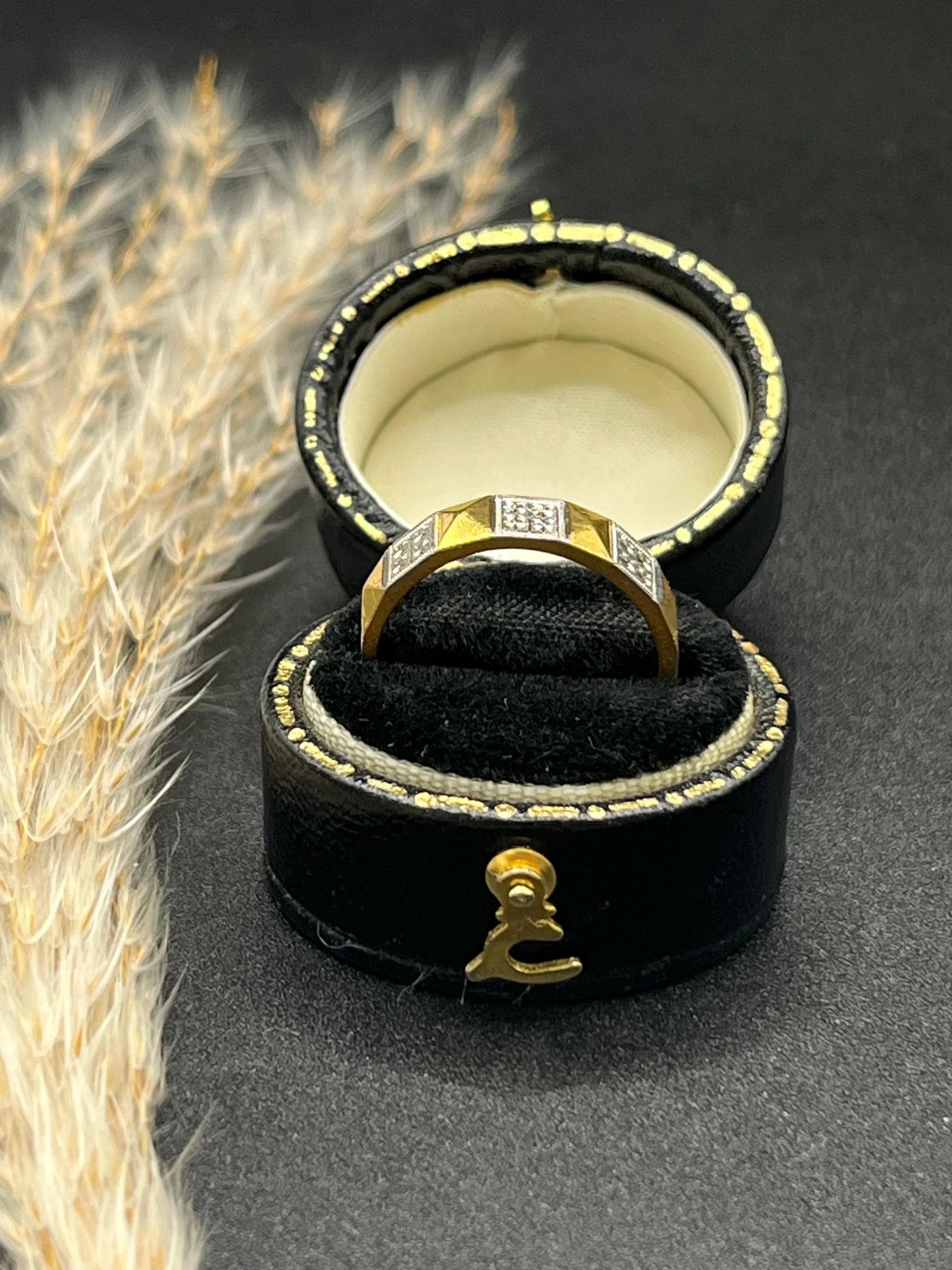 A yellow gold and platinum geometric band ring, in a ring box
