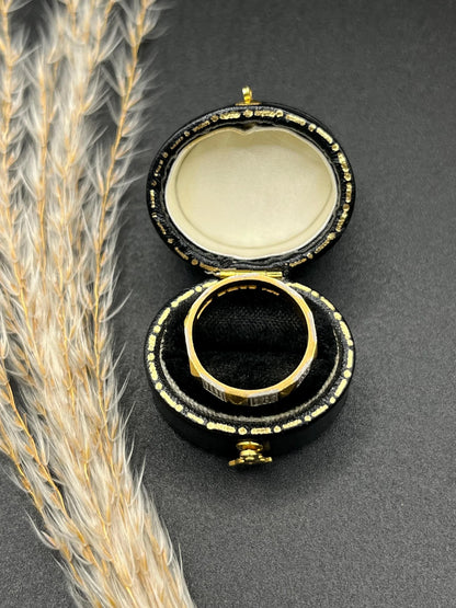 A yellow gold and platinum geometric band ring, in a ring box