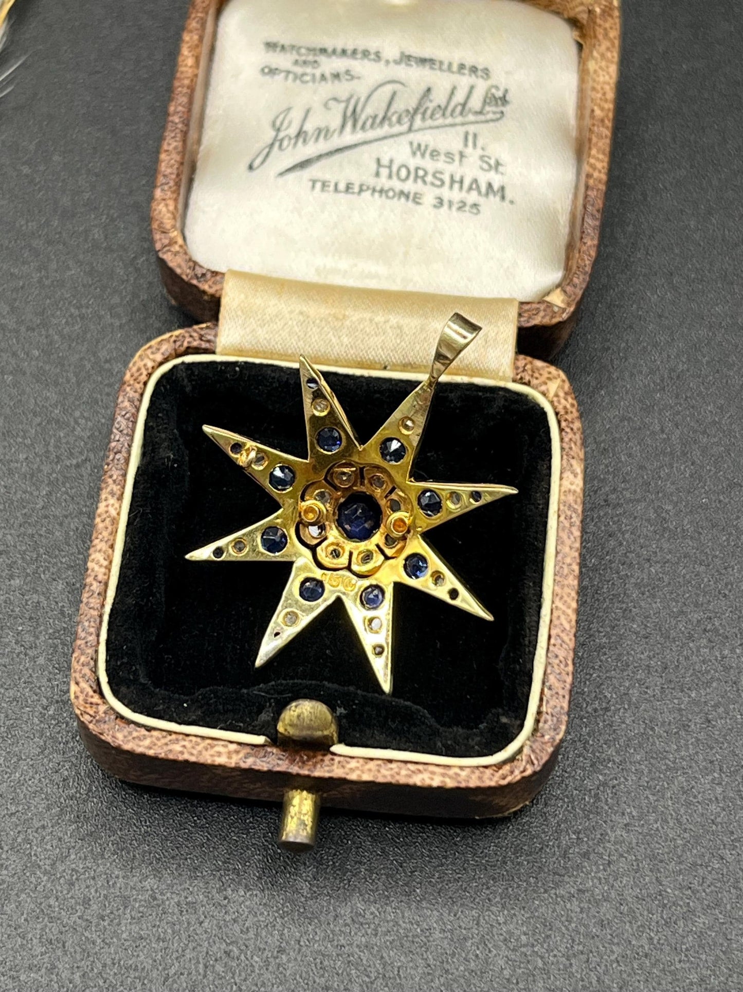 Edwardian 15 Carat Gold Sapphire and Diamond Starburst Pendant, Circa 1900