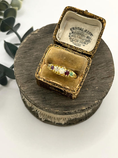 A yellow gold five stone acrostic multi-gemstone ring, in an antique ring box