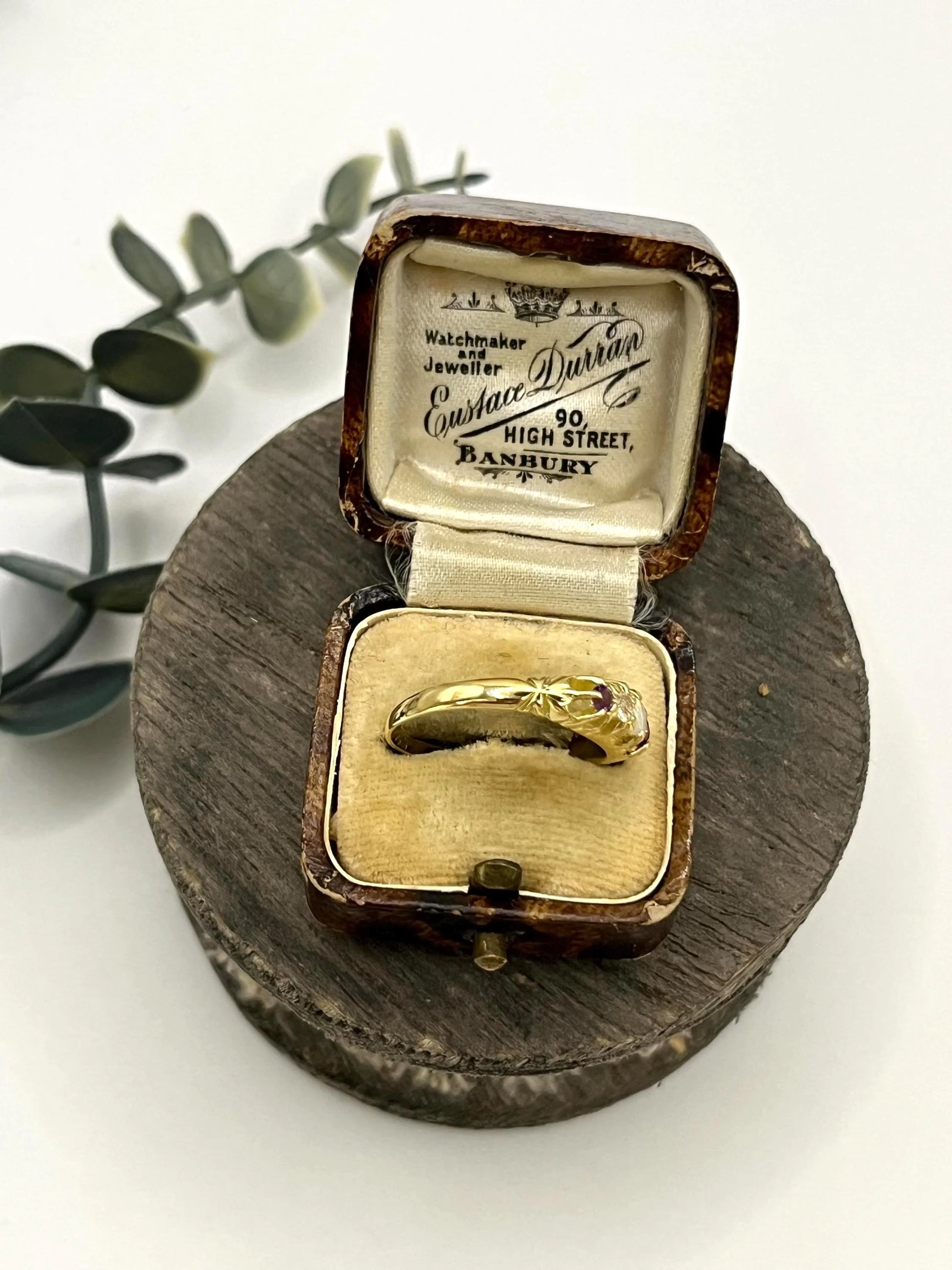 A yellow gold five stone acrostic multi-gemstone ring, in an antique ring box