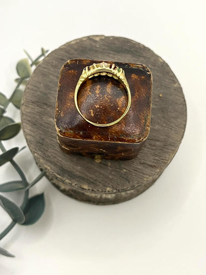 A yellow gold five stone acrostic multi-gemstone ring