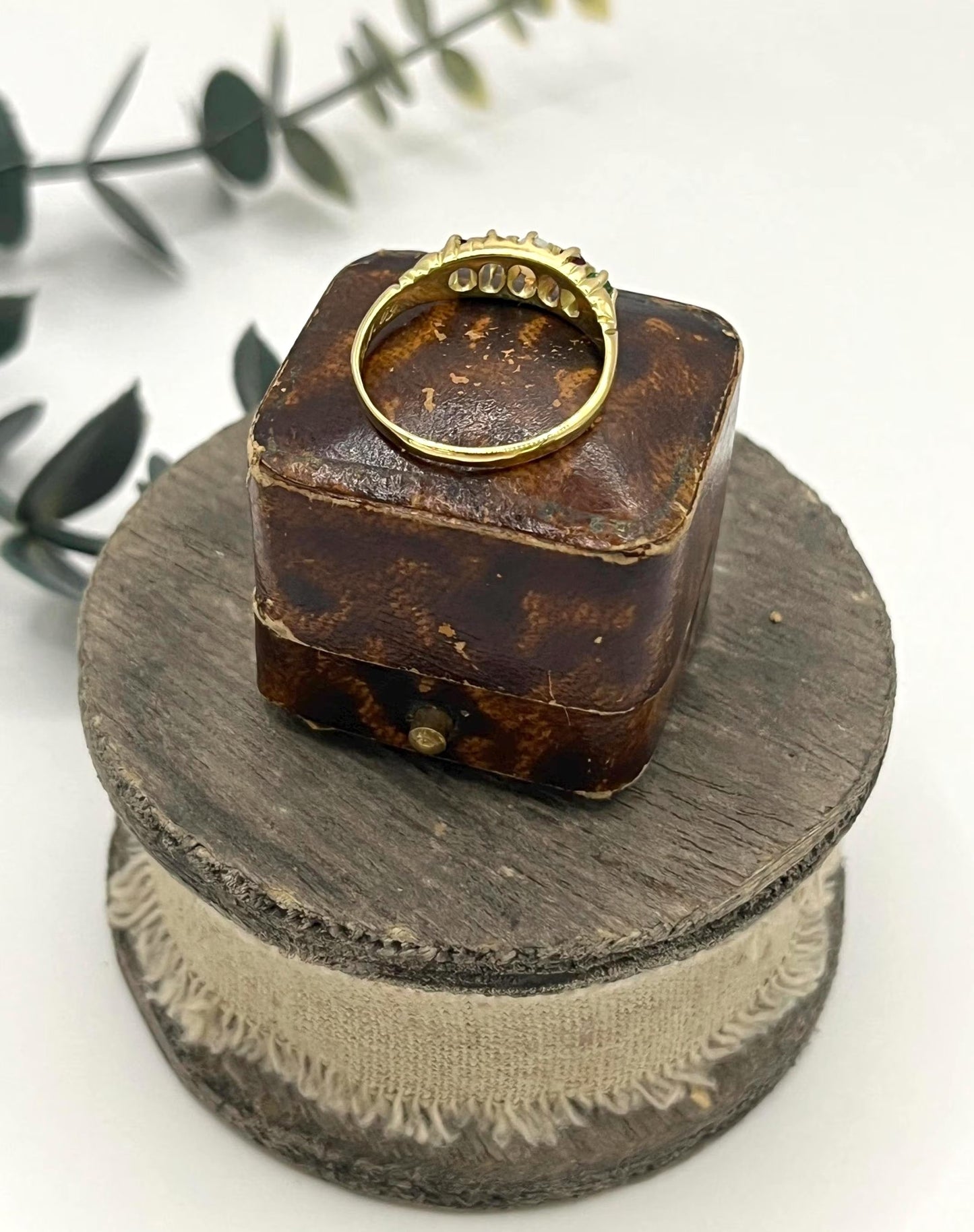 A yellow gold five stone acrostic multi-gemstone ring
