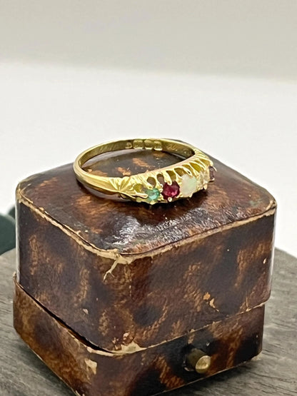 A yellow gold five stone acrostic multi-gemstone ring