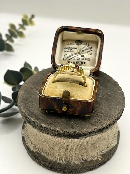 A yellow gold five stone acrostic multi-gemstone ring, in an antique ring box