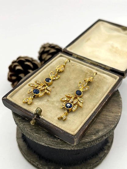 A pair of sapphire and diamond foliate drop earrings in yellow gold, in an antique box