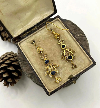 A pair of sapphire and diamond foliate drop earrings in yellow gold, in an antique box