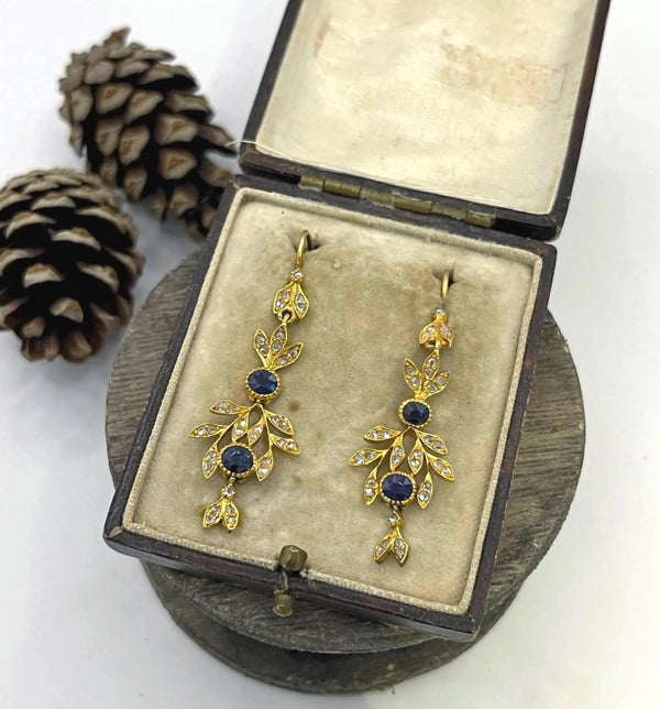 A pair of sapphire and diamond foliate drop earrings in yellow gold, in an antique box