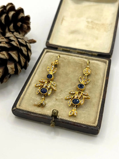 A pair of sapphire and diamond foliate drop earrings in yellow gold, in an antique box