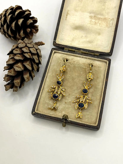 A pair of sapphire and diamond foliate drop earrings in yellow gold, in an antique box