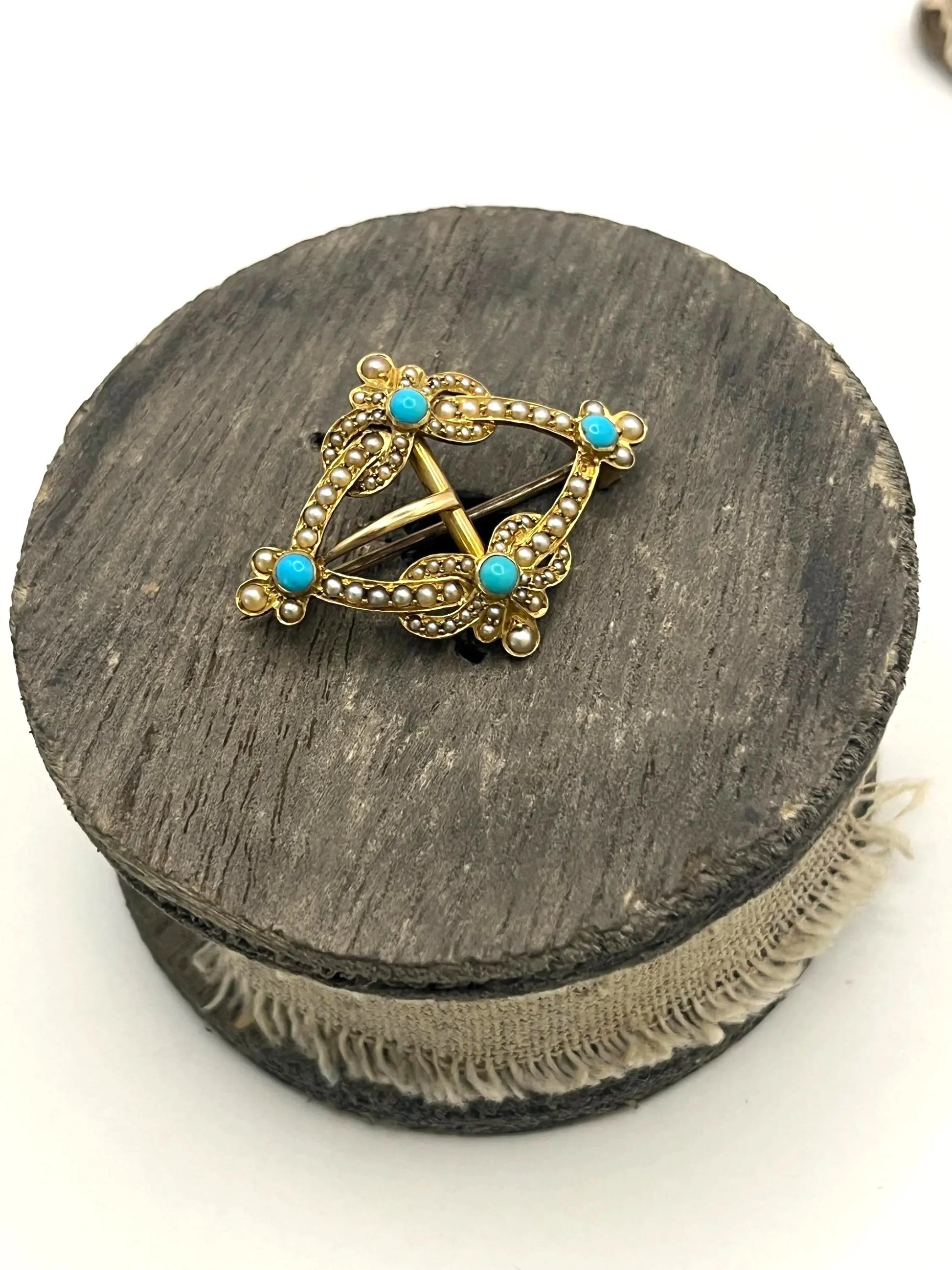 A yellow gold buckle style brooch/pendant with turquoise and seed pearls