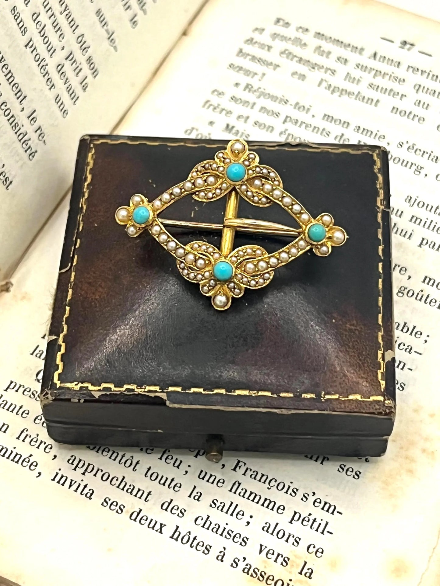 A yellow gold buckle style brooch/pendant with turquoise and seed pearls