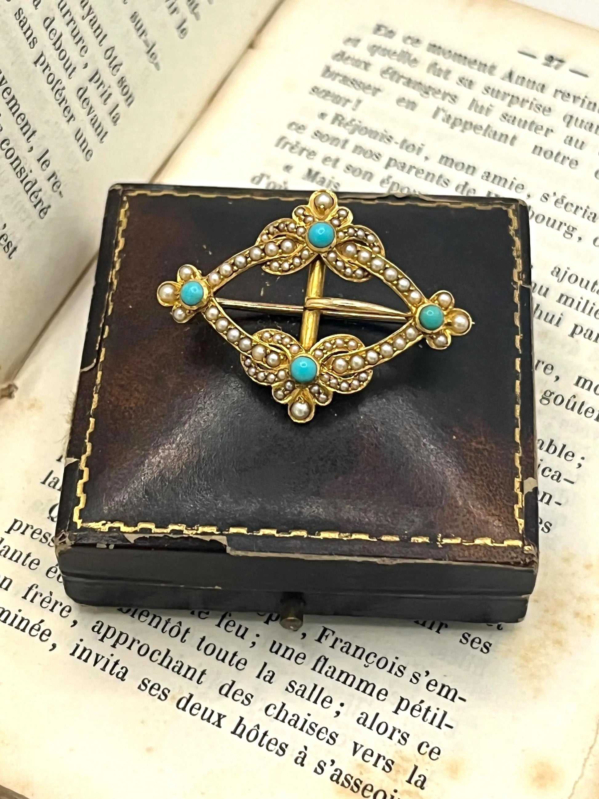 A yellow gold buckle style brooch/pendant with turquoise and seed pearls