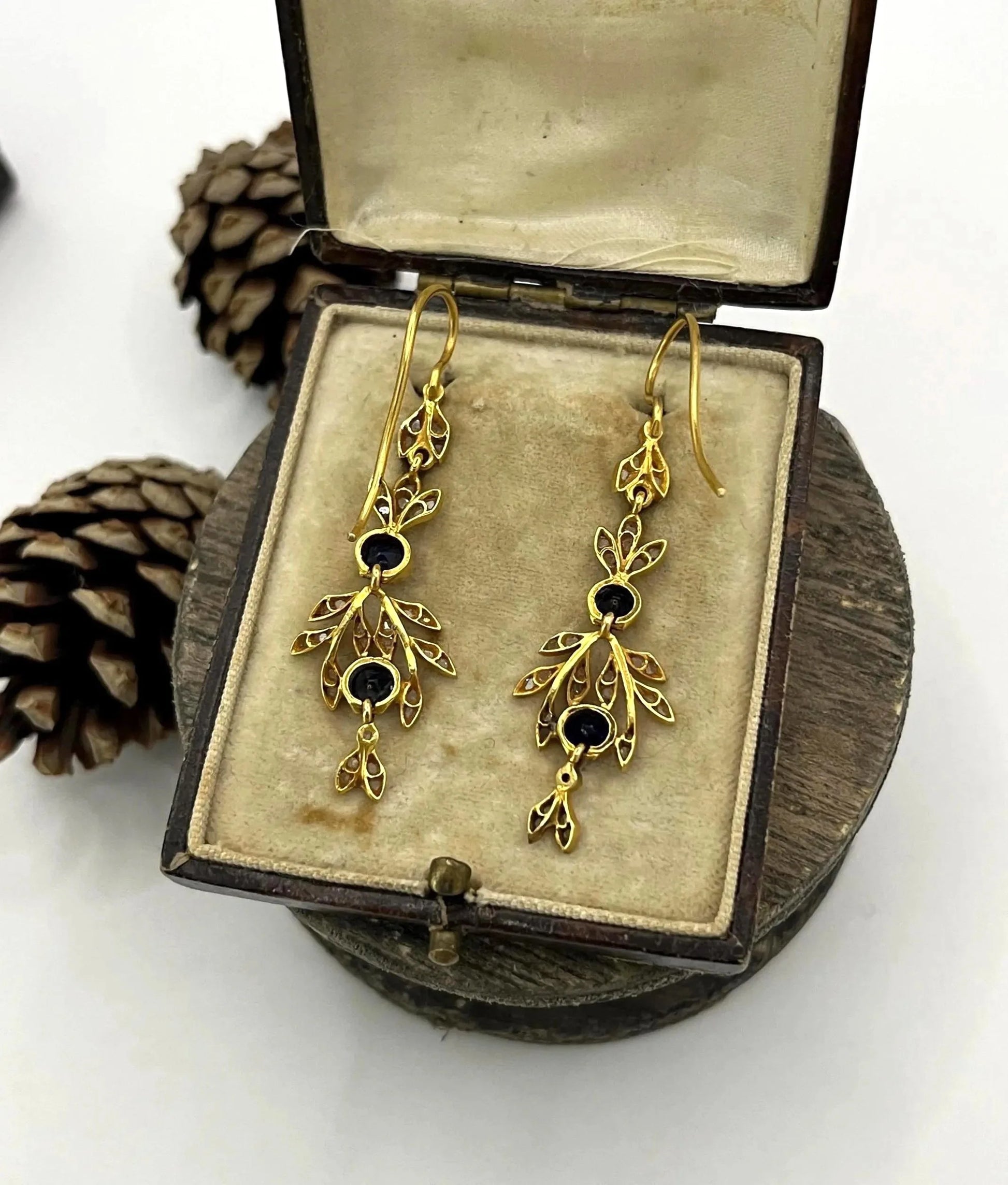 A pair of sapphire and diamond foliate drop earrings in yellow gold, in an antique box