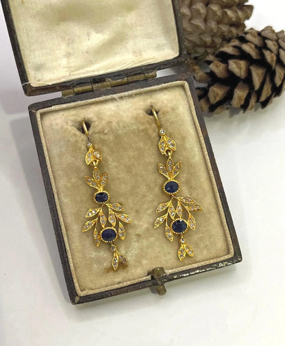A pair of sapphire and diamond foliate drop earrings in yellow gold, in an antique box