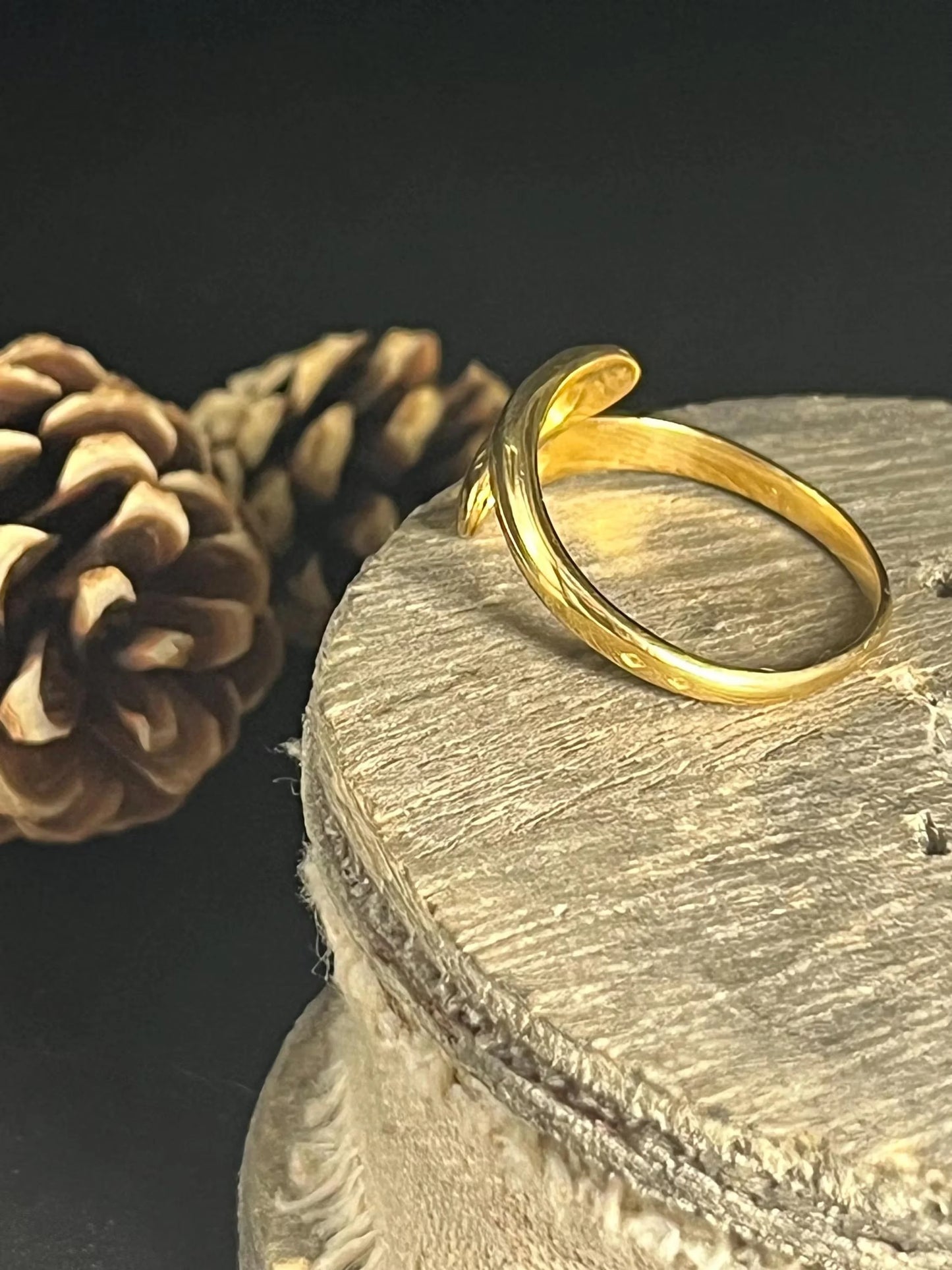 A yellow gold double headed snake ring with diamonds