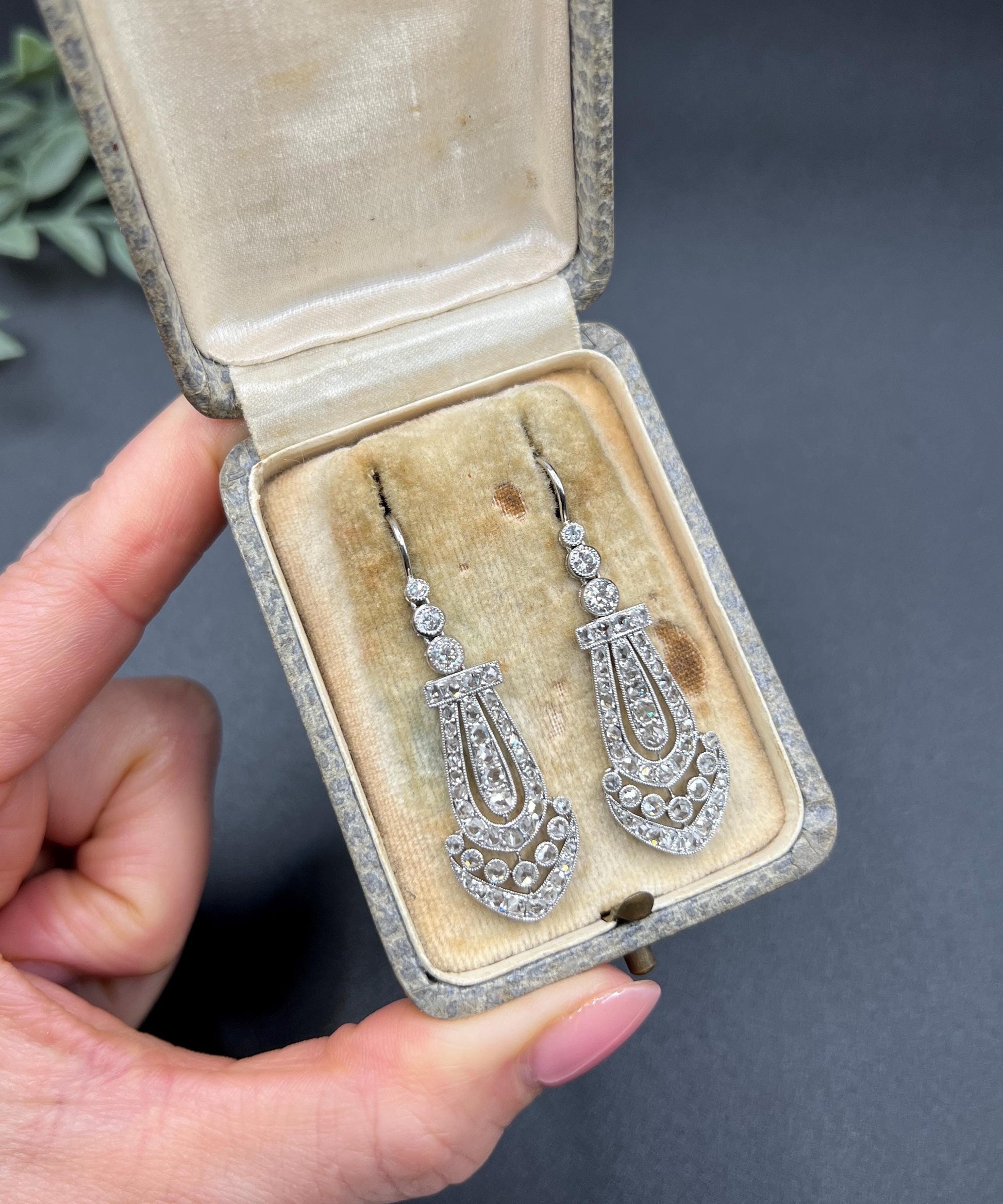 A pair of antique platinum diamond drop earrings, in a box