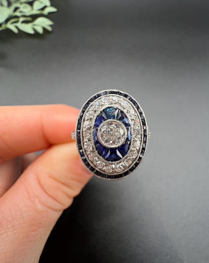 Antique Platinum, Edwardian era Sapphire & Diamond Oval Halo Cluster ring