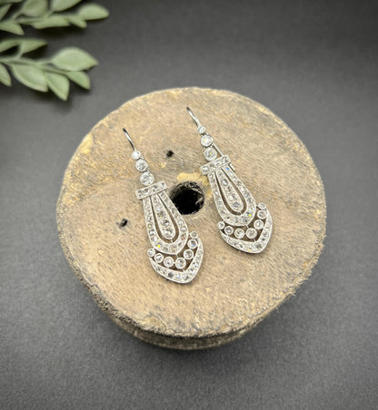 A pair of antique platinum diamond drop earrings